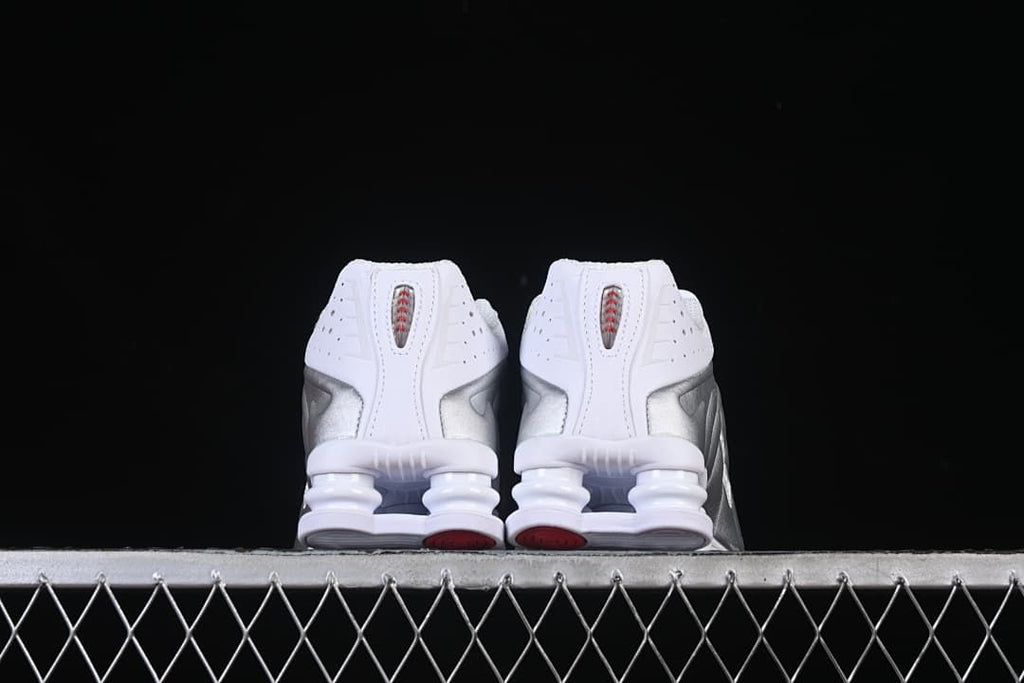 Rear view of both sneakers showing their heel columns