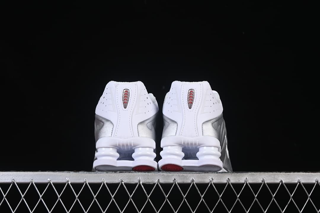 Rear view of both sneakers showing their heel columns