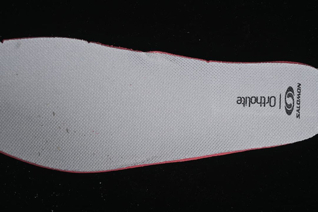 Light-colored insole with Salomon and Ortholite markings.