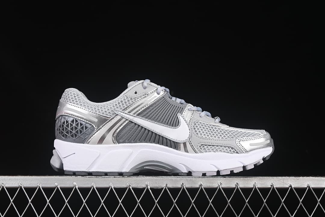 Side profile of the silver and grey sneaker