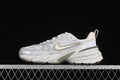 Side view of a white and light grey Nike V2K Run sneaker with muted olive accents