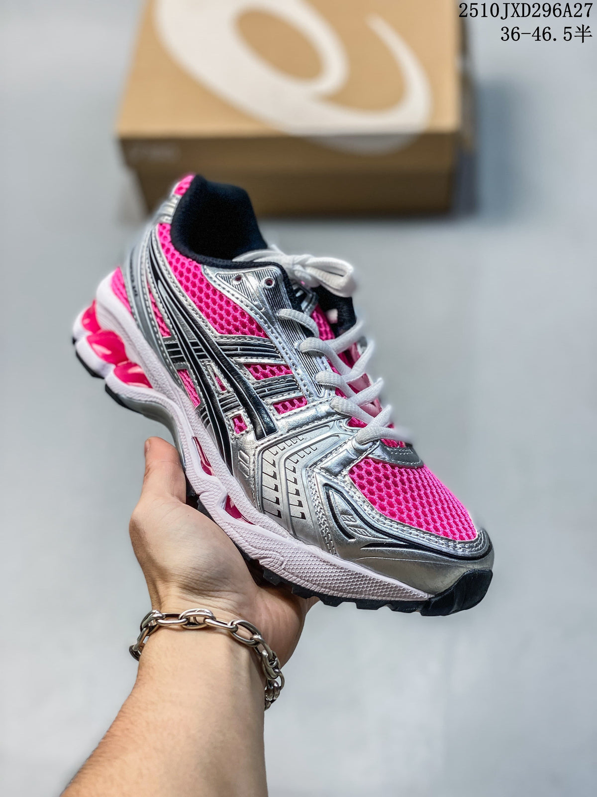Silver and black mesh sneaker with bright pink panels and white laces, held in hand.