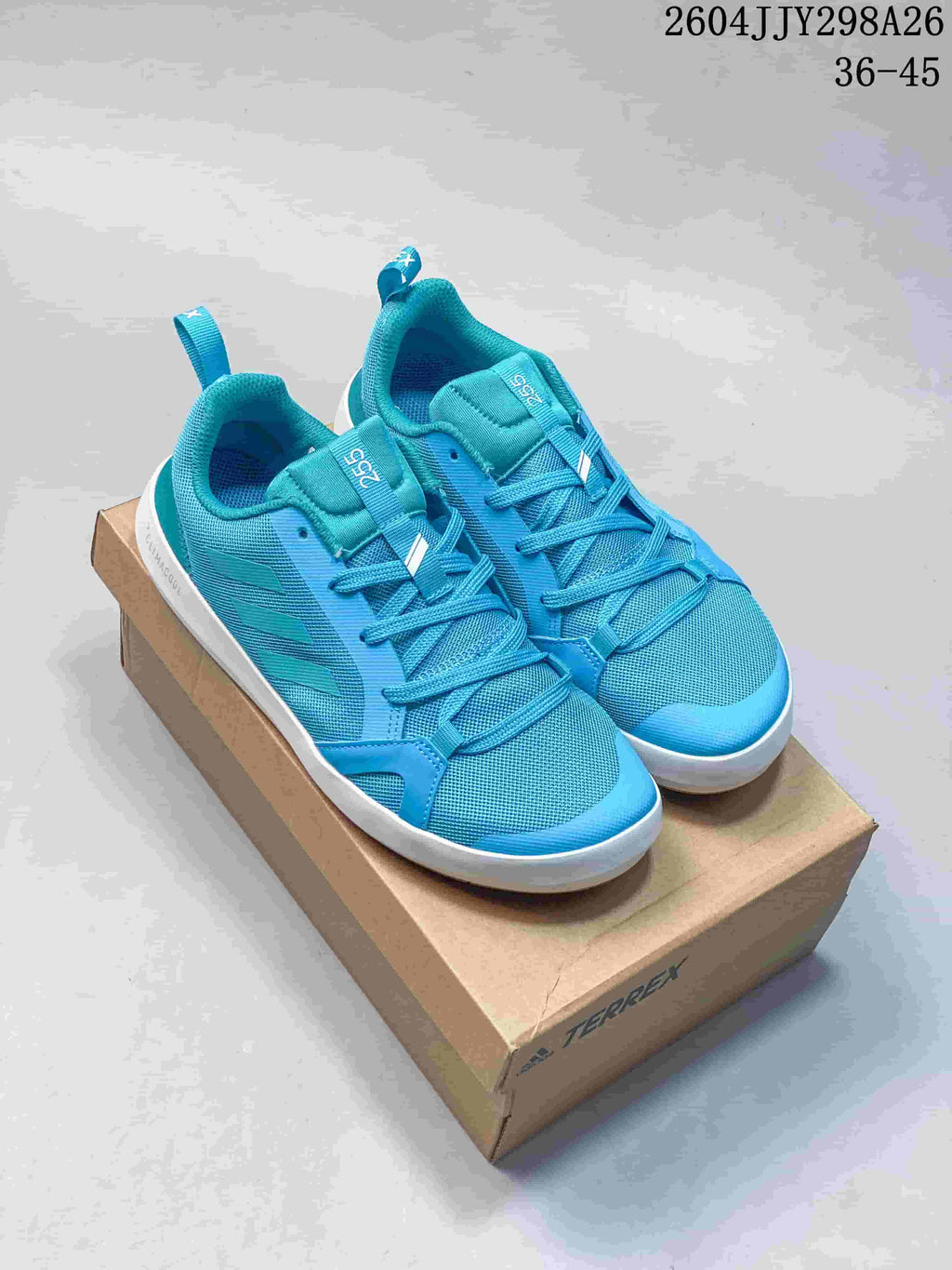 Pair of turquoise Adidas Terrex Boat shoes shown from above at an angle