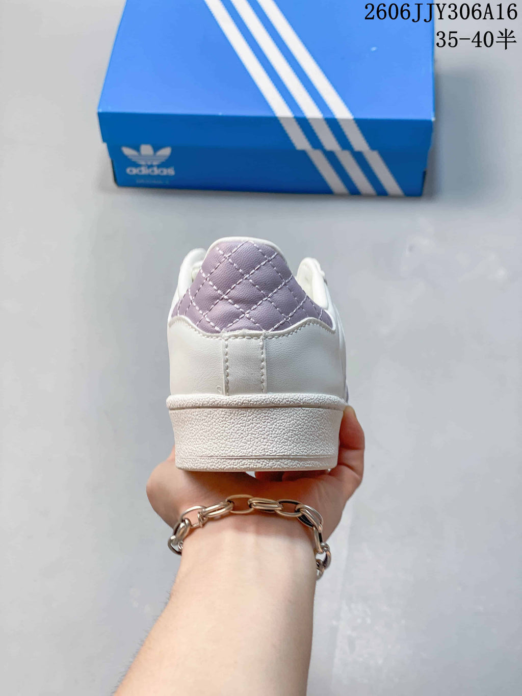 Rear view of the sneaker with a lilac quilted heel accent