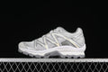 Side view of silver-gray Salomon XT-Quest GTX sneakers.
