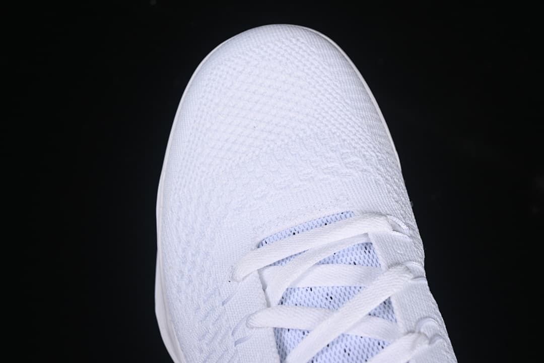 Top-down close-up of the white textured toe and lace area