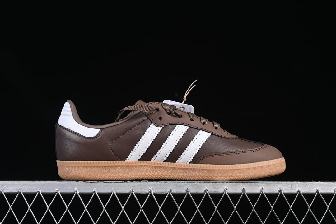 Side profile of a brown sneaker with white stripes and gum outsole