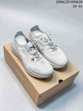 Pair of white and light gray Descente Lavitate 3.0 Wire shoes on a box