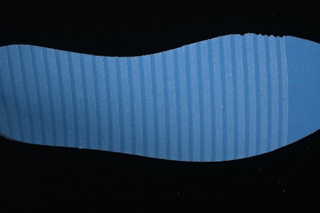 Close-up of the blue ribbed outsole surface