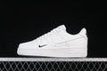 Side view of a white low-top Air Force 1 ’07 sneaker with small black Swoosh accents