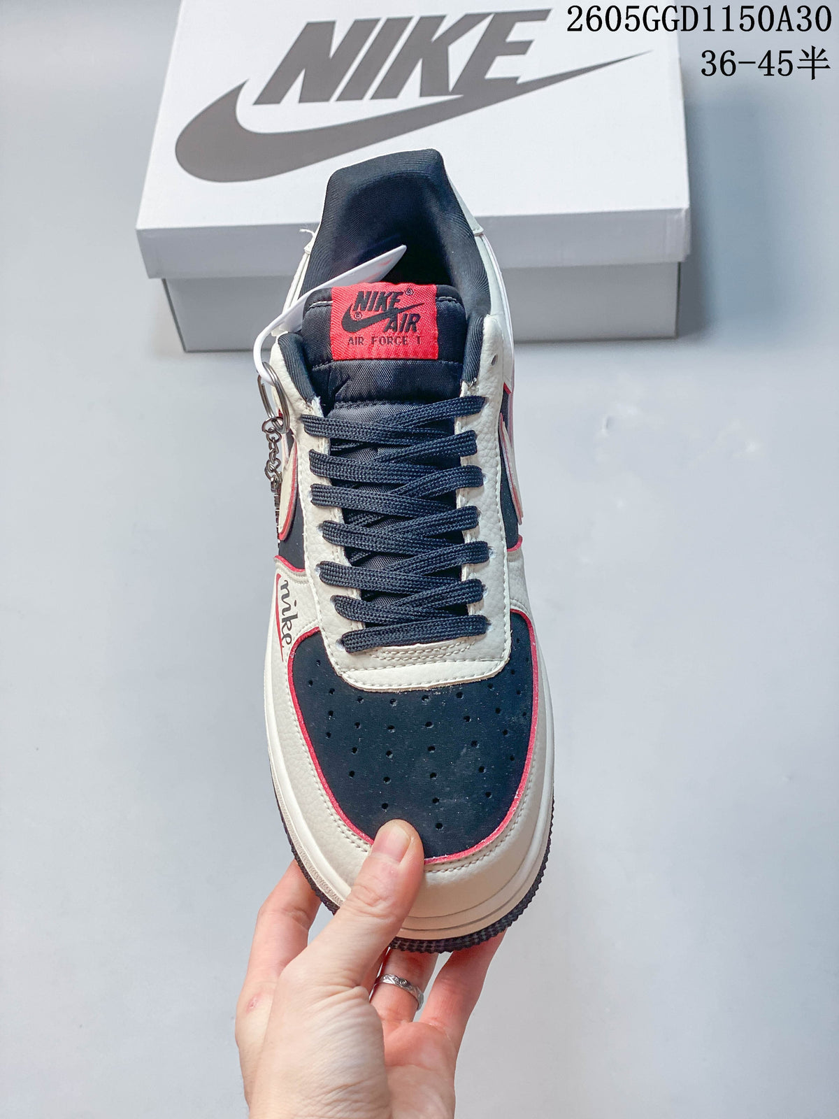 Front view showing the perforated toe, dark laces and red tongue label