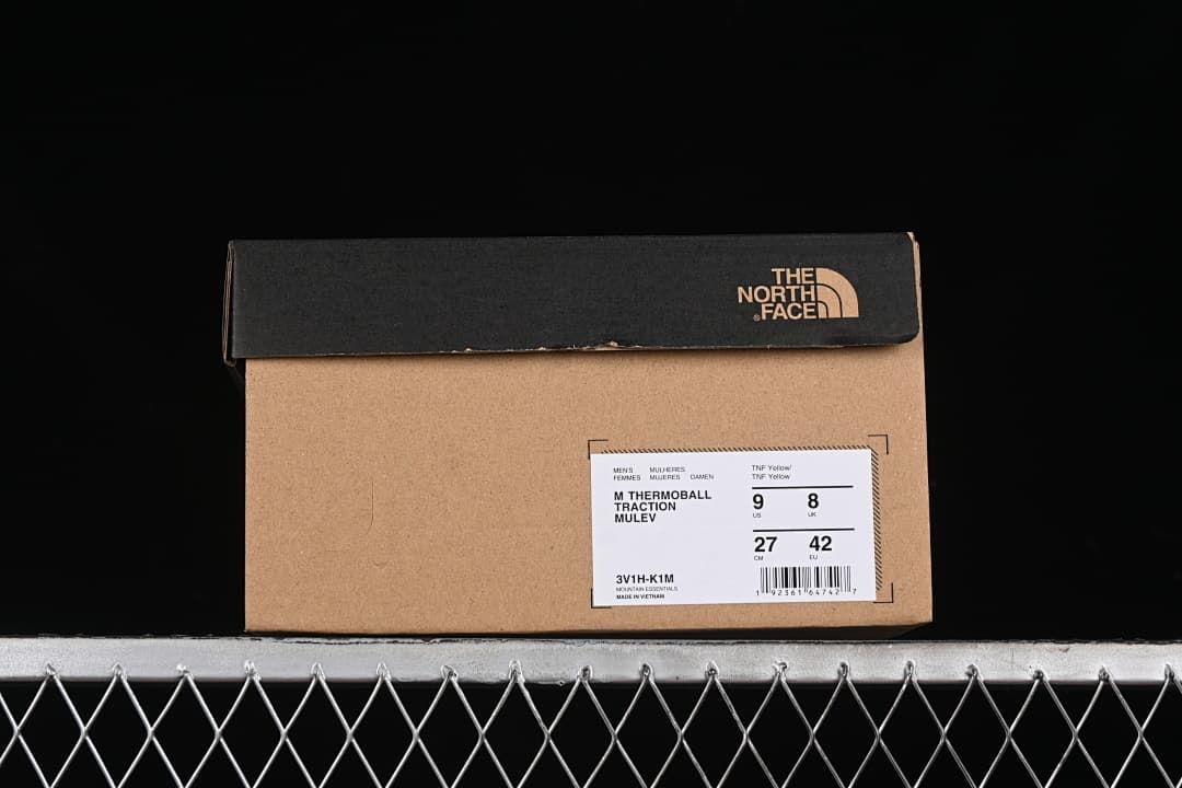 Product box label identifying Thermoball Traction Mule in TNF Yellow, with a sample size of US 9, UK 8, EU 42, and 27 cm.