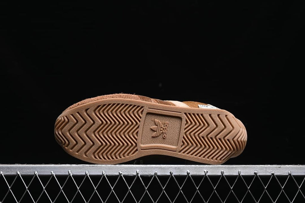 Underside showing the chevron-patterned rubber outsole