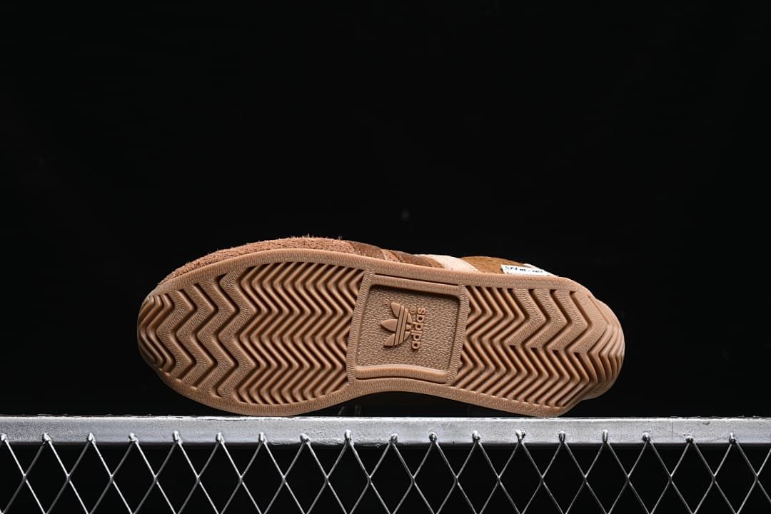 Underside showing the chevron-patterned rubber outsole
