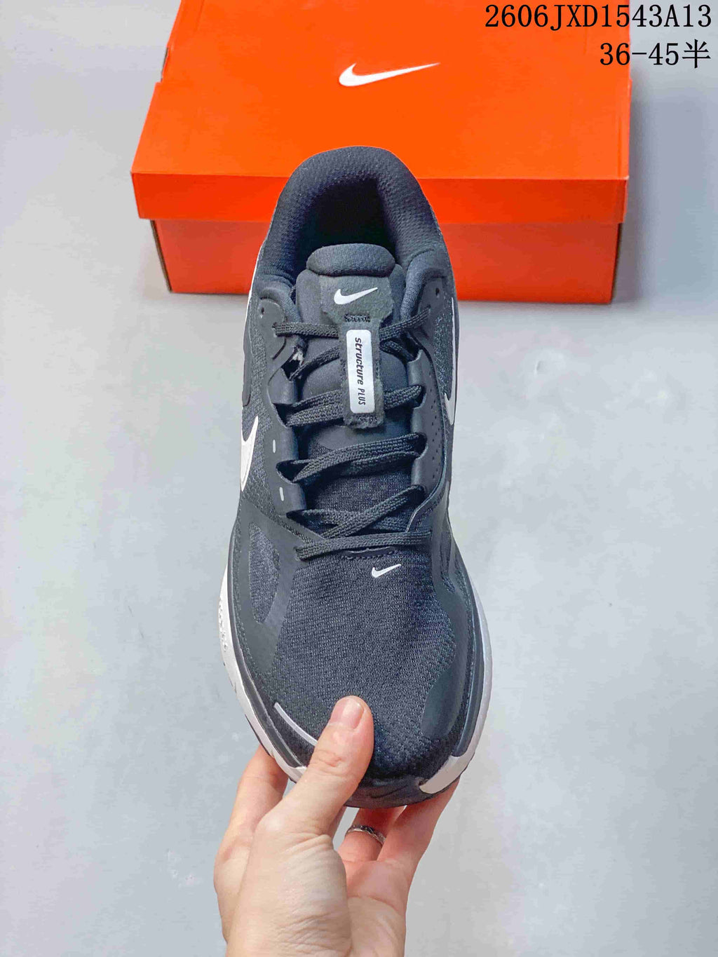 Top view showing the laces, tongue, and charcoal upper.