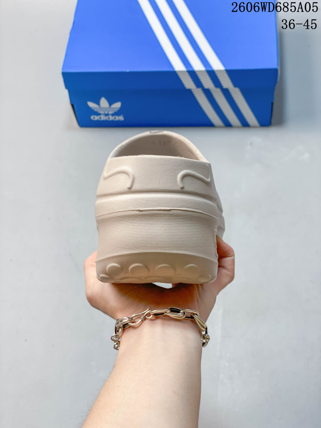 Rear view of a light beige adidas AdiFOM Stan Smith Mule clog.