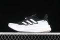 Side view of black and white Adidas Ultraboost 5 shoe