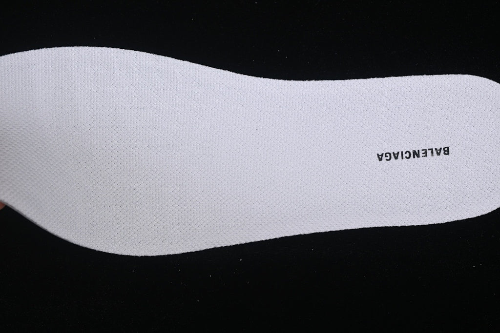 White removable insole with printed branding.