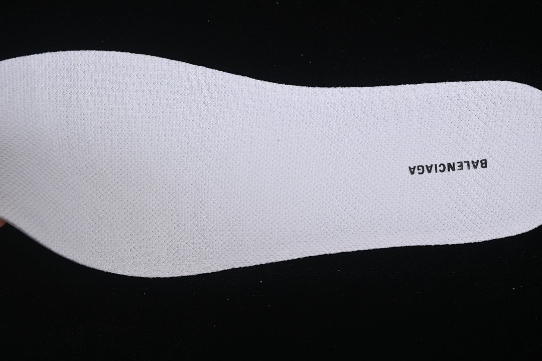 White removable insole with printed branding.