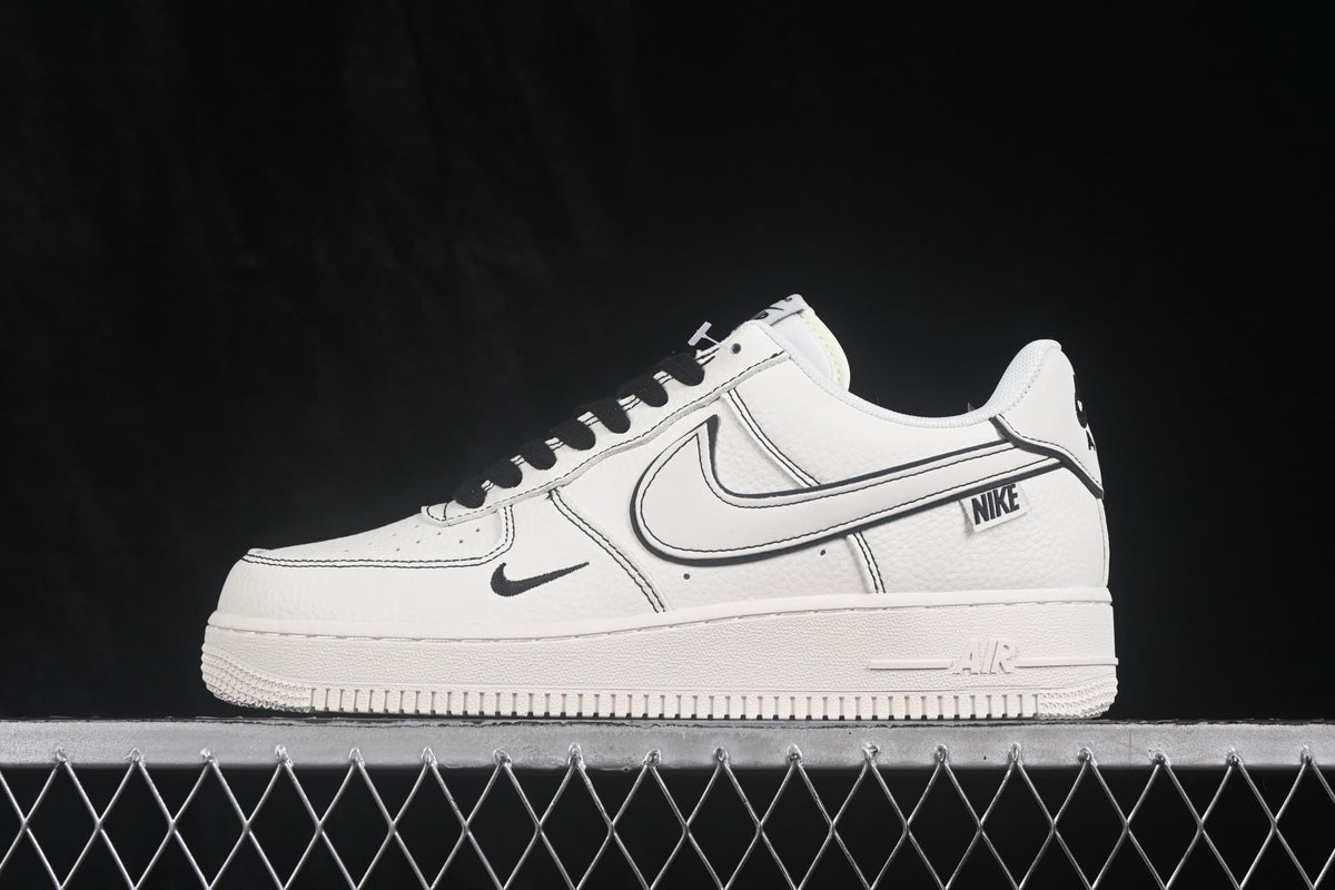 Side profile showing the white low-top upper, black outlined Swoosh and layered rubber sole.