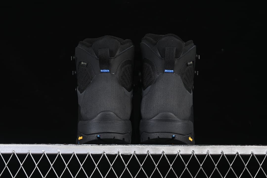 Rear view of the pair showing heel panels and outsole details