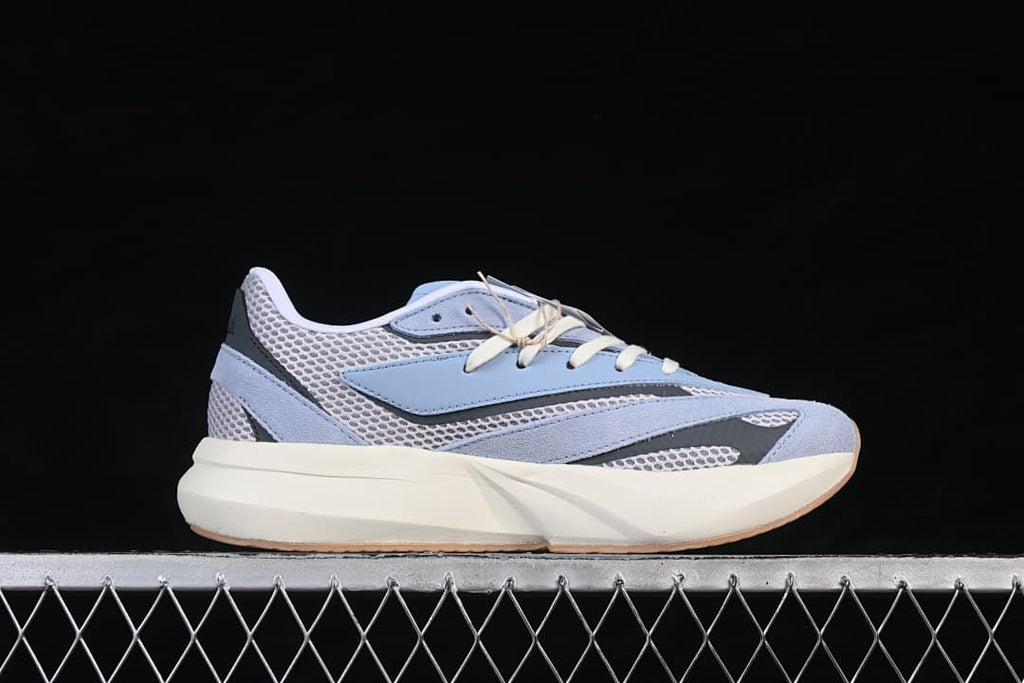 Side profile of the light blue and gray Lightblaze running shoe