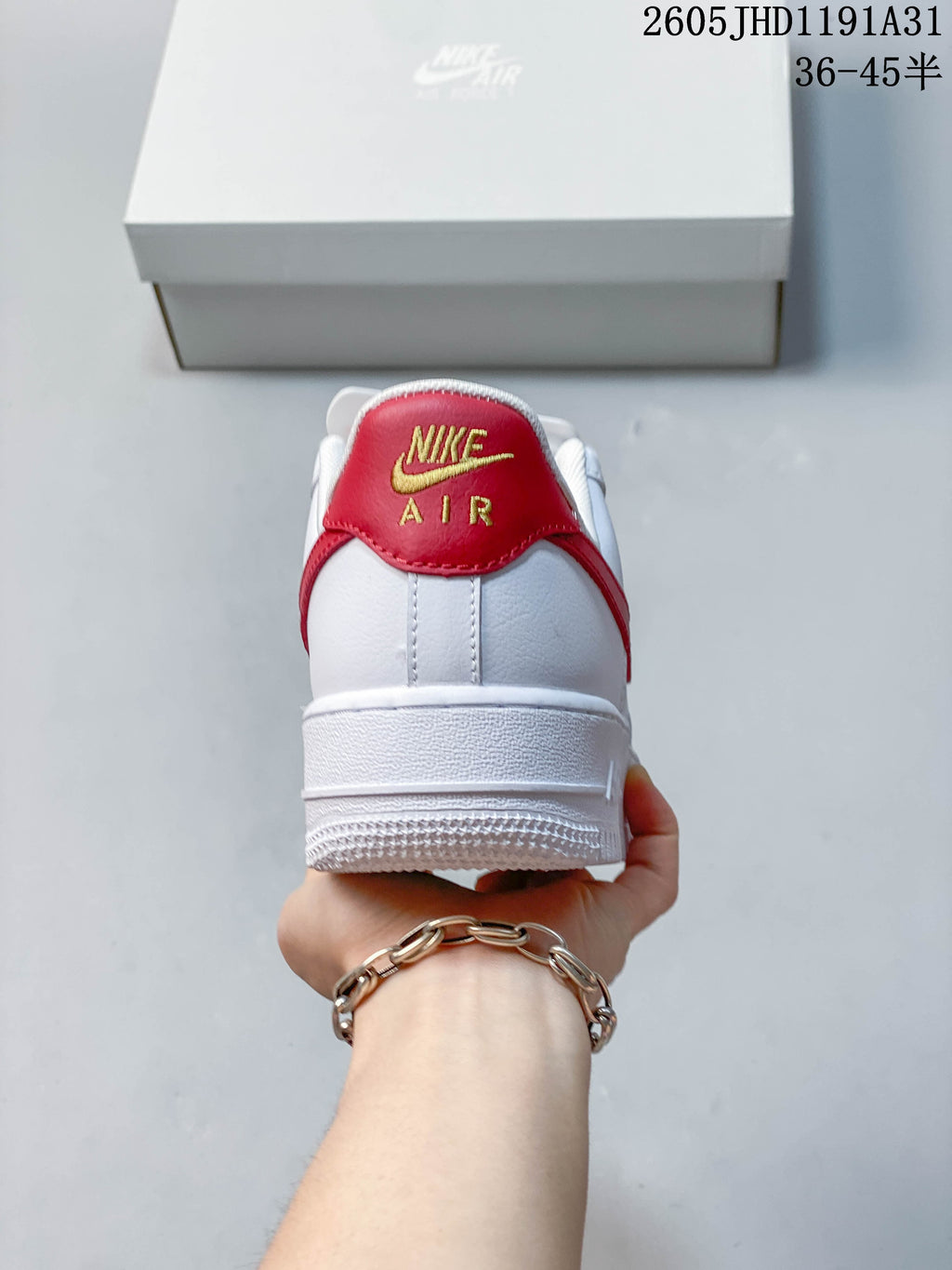 Rear view showing the red heel tab and white heel of the sneaker