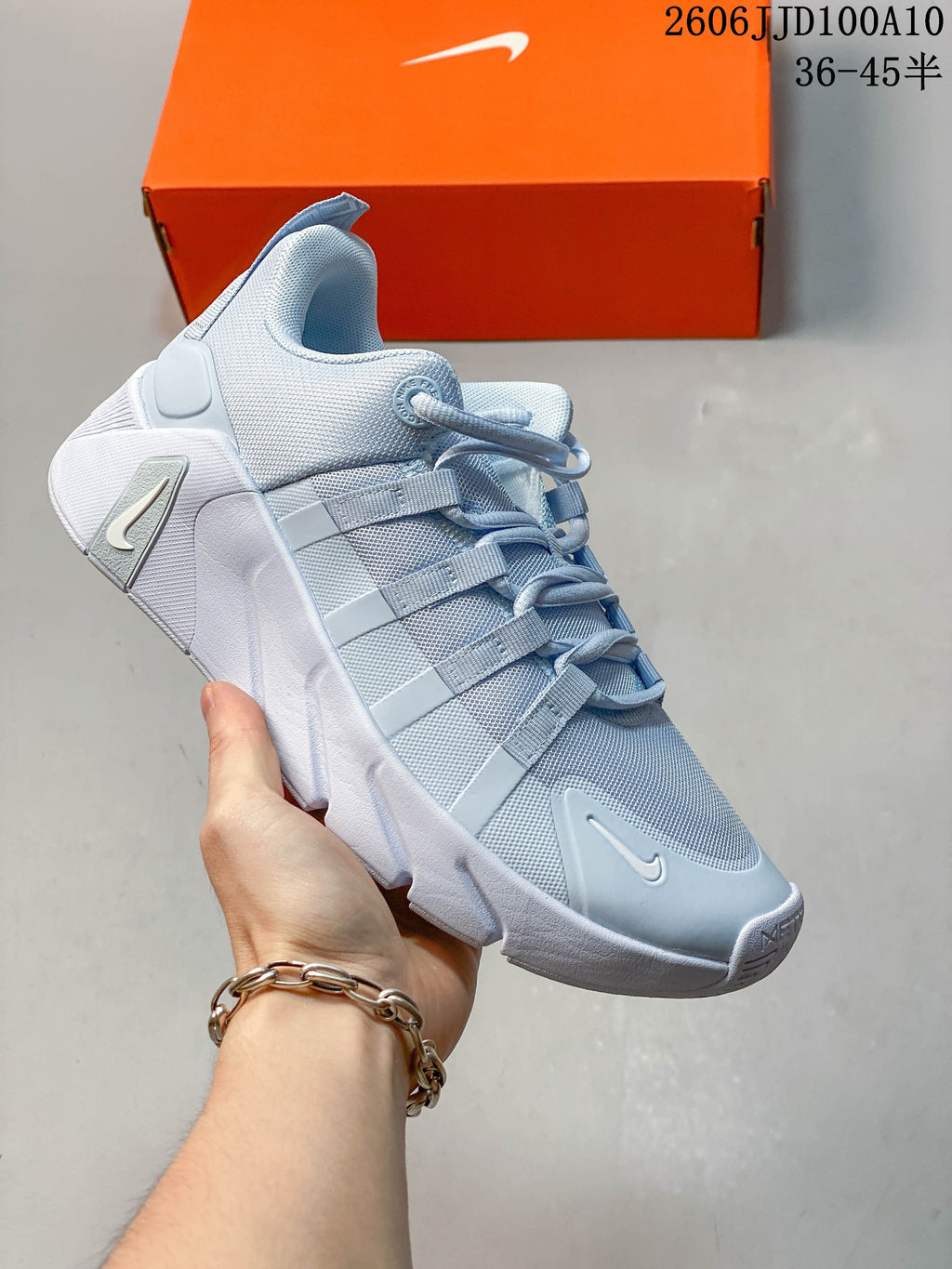 Pale blue and white Nike Free Metcon 7 shoe shown at an angle.
