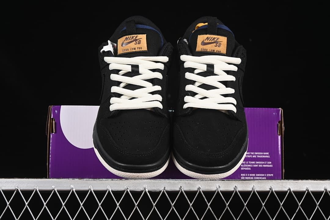 Front view of the pair showing perforated toes, white laces, and tan tongue labels