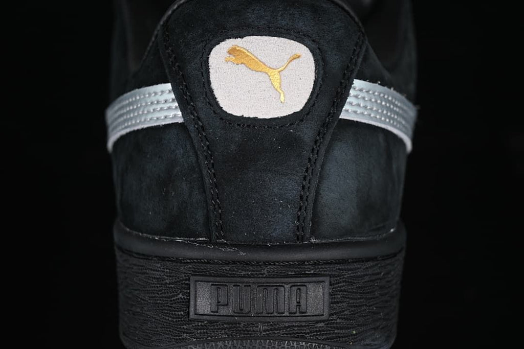 Rear view showing the Puma logo, silver detailing, and black heel sole.