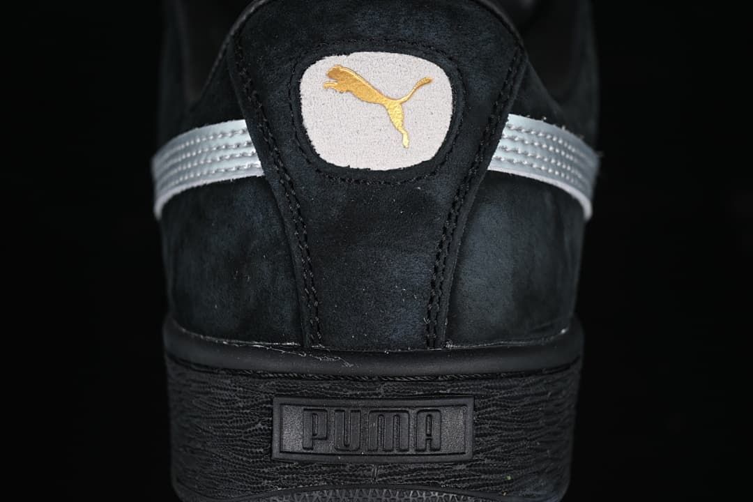 Rear view showing the Puma logo, silver detailing, and black heel sole.