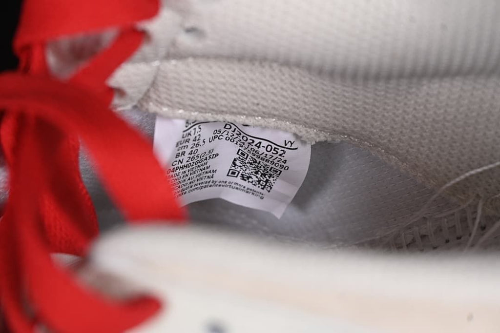 Close-up of the interior size label beside red laces