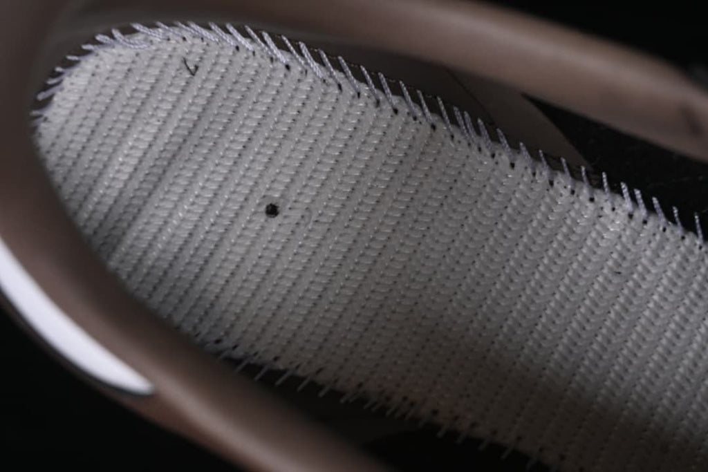Close-up of the textured inner lining of a brown sneaker
