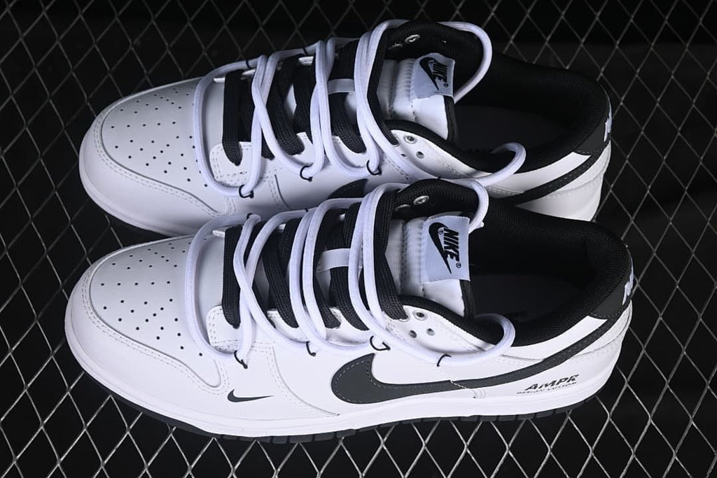 Overhead view of the pair of white and black low-top sneakers