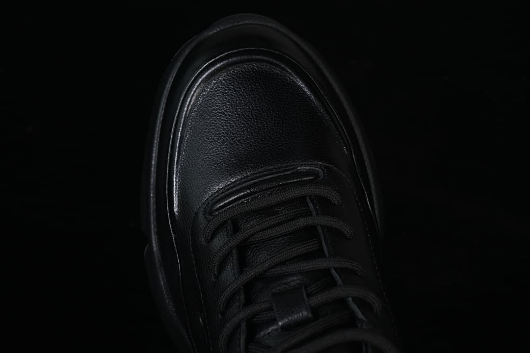 Top view of the sneaker toe and lace-up front