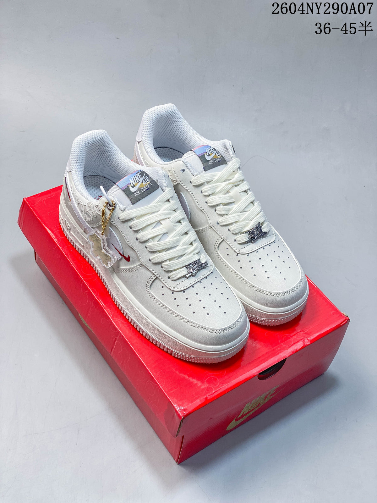 Pair of white Nike Air Force 1 low-top sneakers with horse-themed details on a red presentation box
