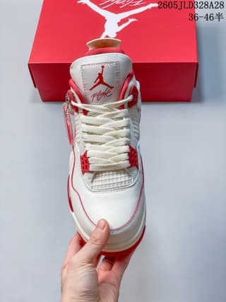 Front view of a white and red Air Jordan 4 sneaker