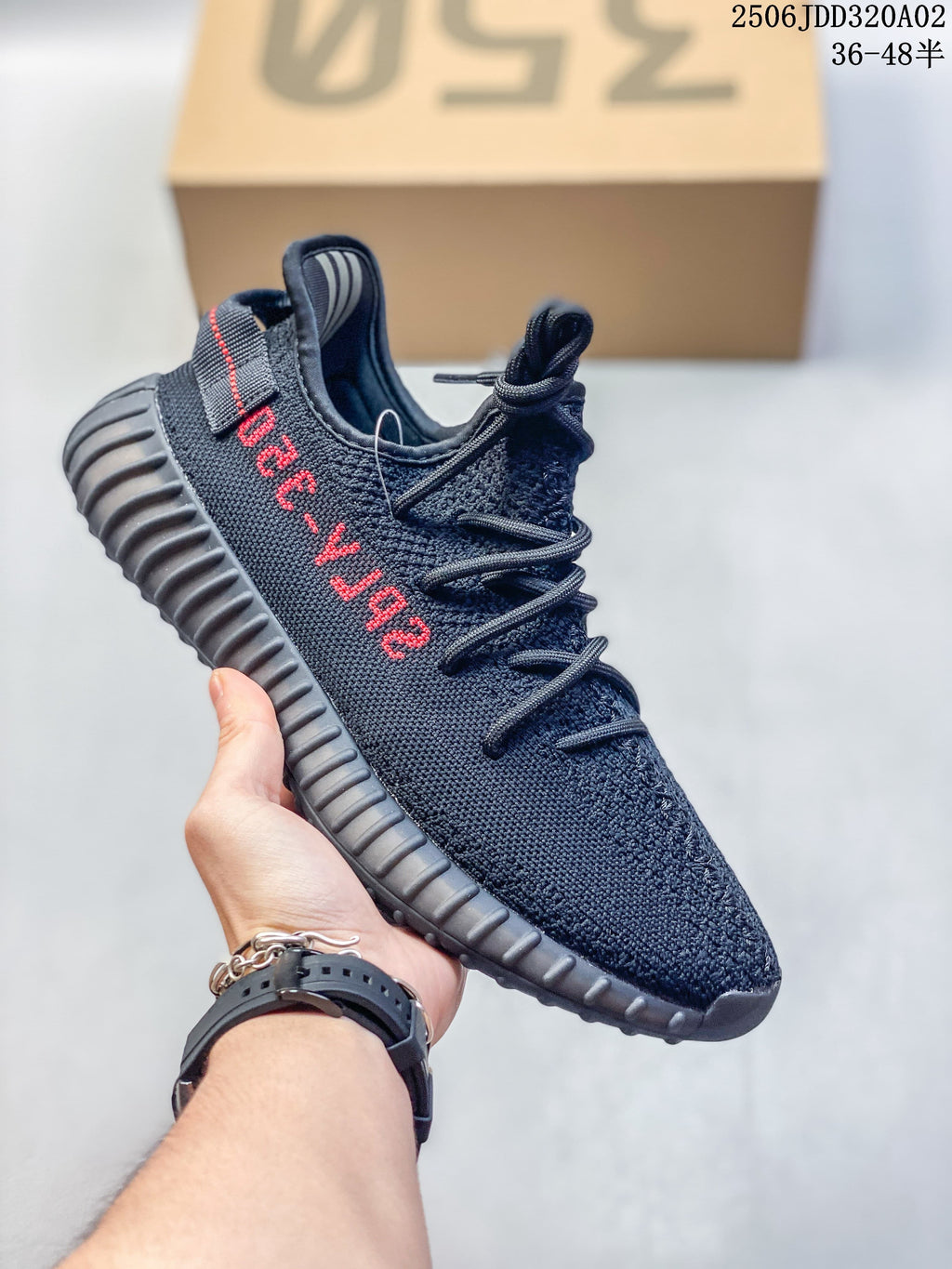 Dark navy Adidas Yeezy-style low-top sneaker with a ribbed sole