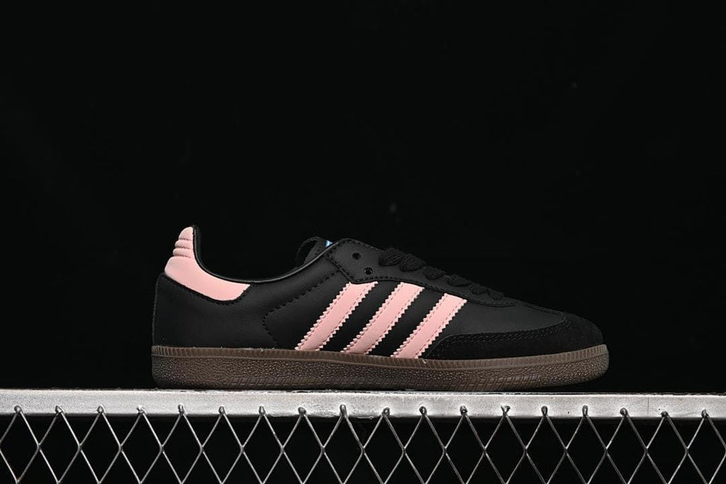 Side profile showing black upper and pink stripes