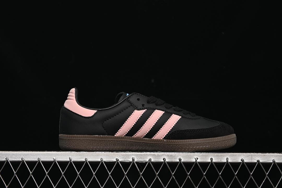 Side profile showing black upper and pink stripes
