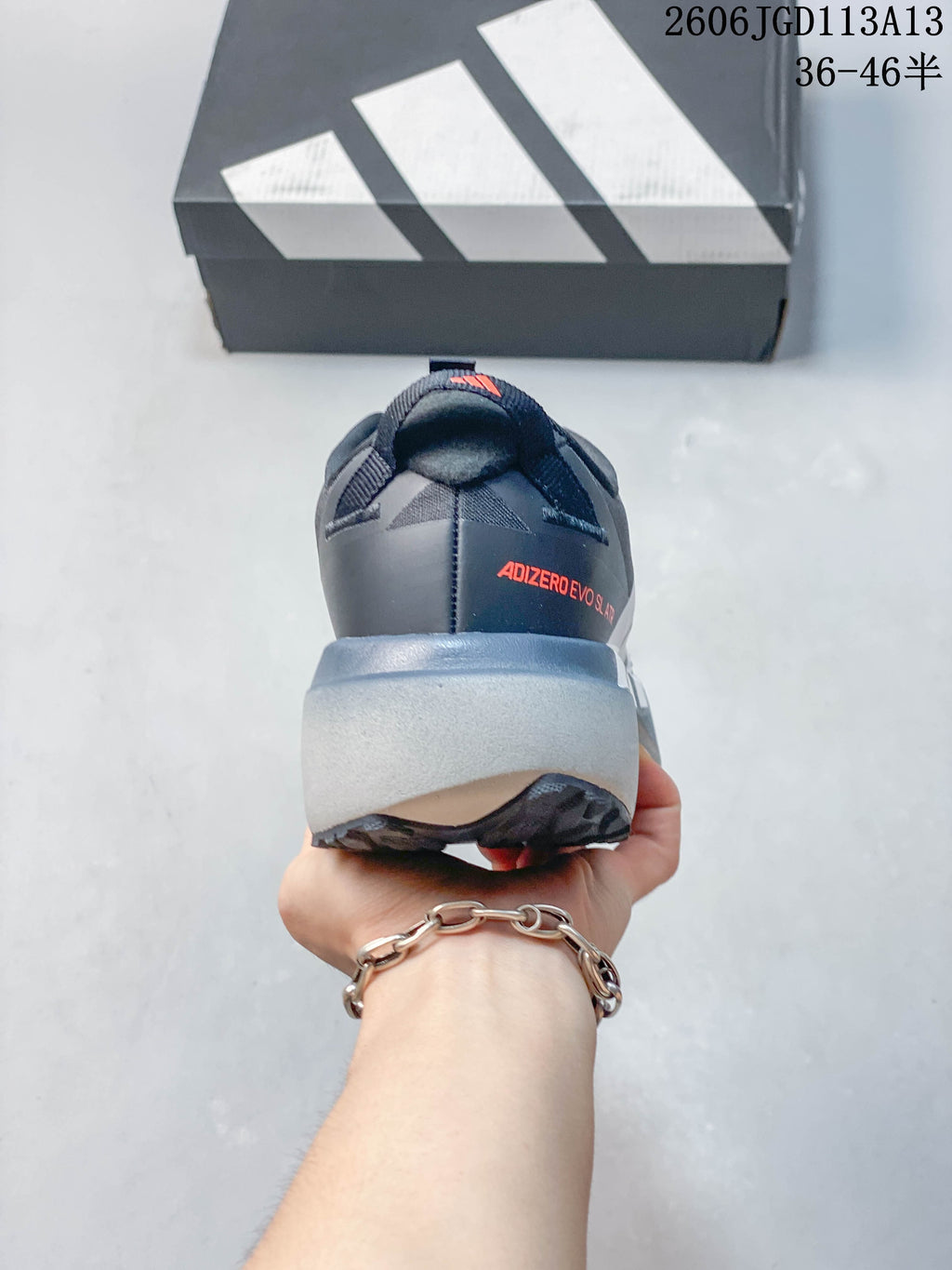 Rear view of the shoe showing the heel branding and thick gray midsole.