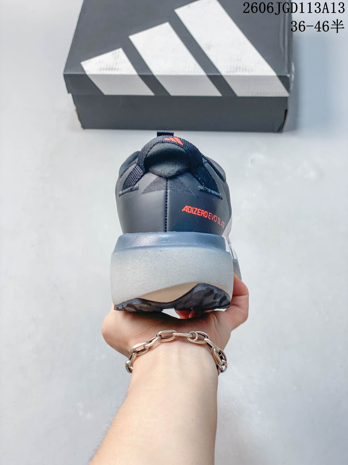 Rear view of the shoe showing the heel branding and thick gray midsole.
