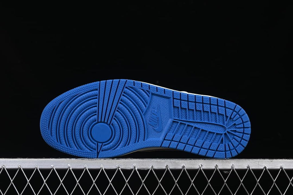 Blue outsole with circular forefoot tread and patterned grooves