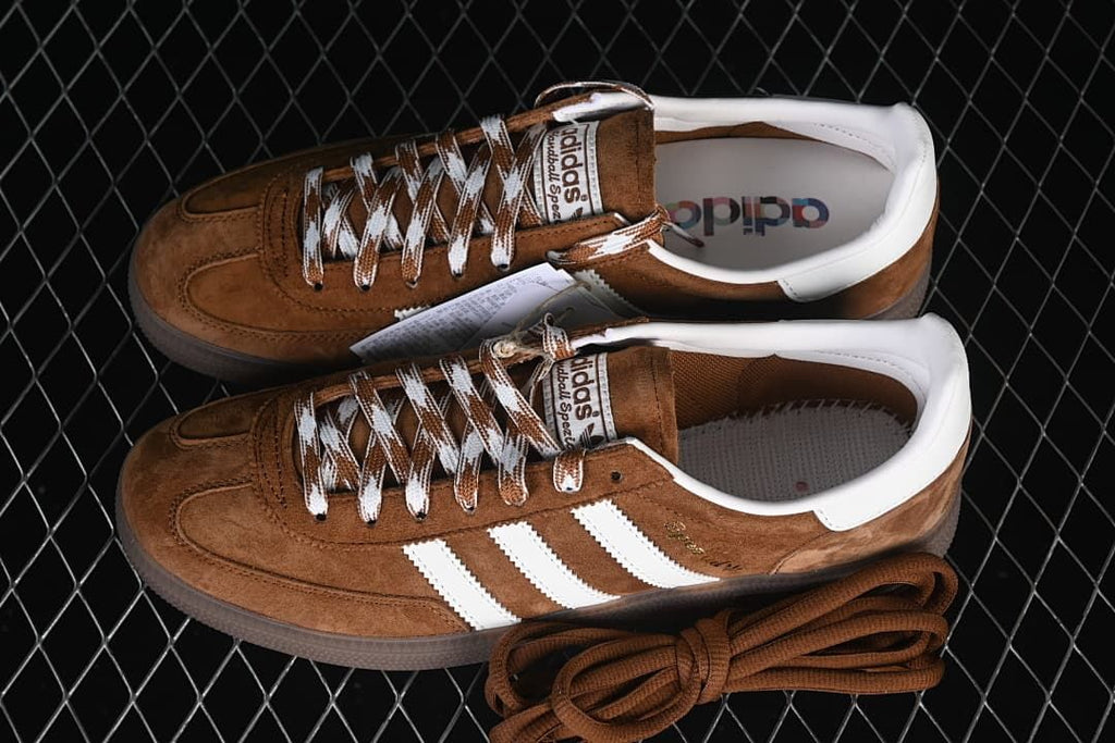 Pair of brown and white Handball Spezial sneakers shown from above