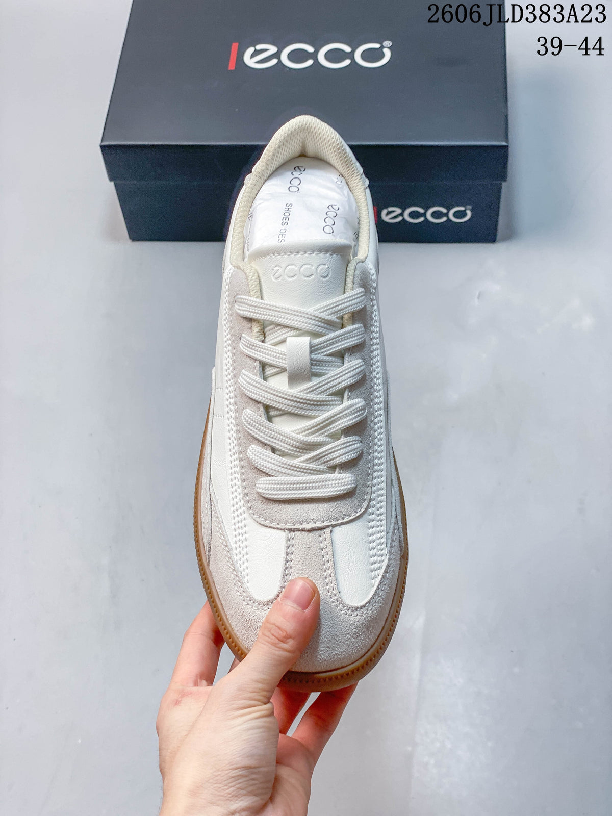 Top view of the sneaker showing its laces and panelled upper