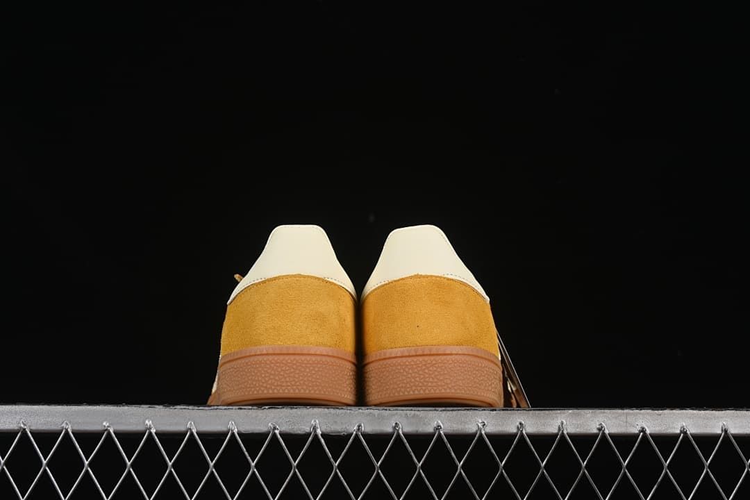 Rear view of the pair showing cream heel panels and gum-colored soles
