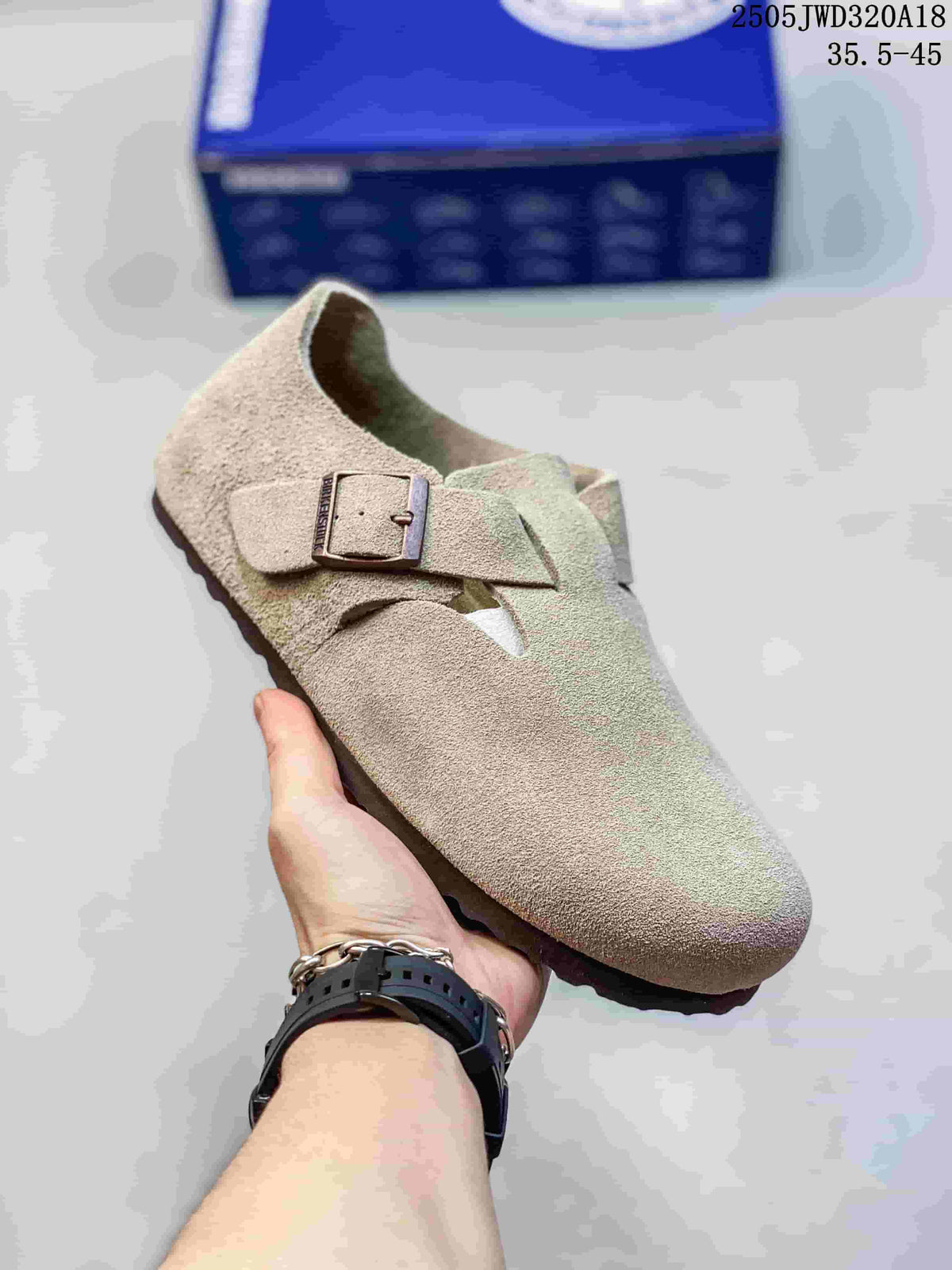 Taupe closed-toe clog with two buckle straps; a box is visible in the background.