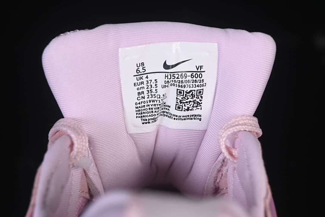Close-up of the sneaker tongue label showing sample size and style code HJ5269-600.
