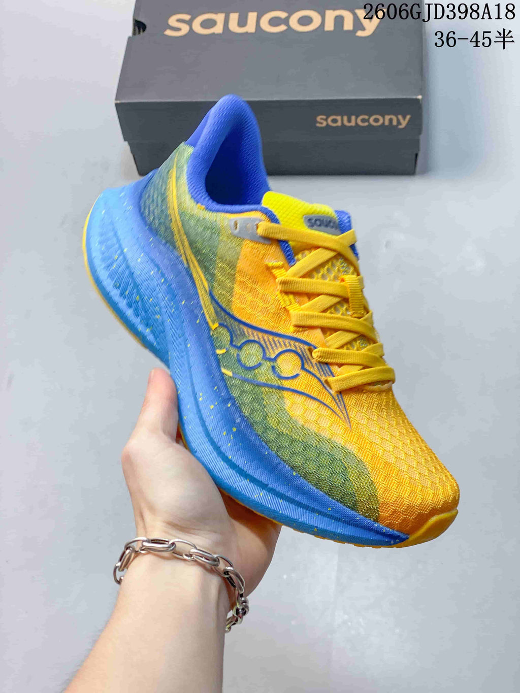 Angled side view highlighting the yellow, green, and blue color blocking