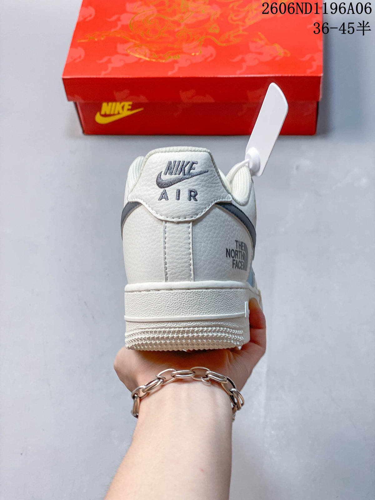 Rear view showing heel branding and off-white upper.